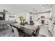 Open concept kitchen and dining area with stainless steel appliances and modern design at 225 Sul Ponticello Ave, Las Vegas, NV 89011