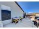 Side view of backyard area with patio, outdoor furniture, and block wall for privacy at 2345 Steinke Ln, Las Vegas, NV 89108