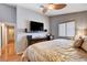 Bedroom featuring a ceiling fan, a large television, and a neutral color scheme for a relaxing retreat at 2345 Steinke Ln, Las Vegas, NV 89108