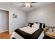 Comfortable bedroom featuring fan, neutral wall color, bedside table, and laminate floors at 2345 Steinke Ln, Las Vegas, NV 89108