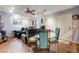 Cozy dining area with track lighting, adjacent to comfortable living space with plush seating at 2345 Steinke Ln, Las Vegas, NV 89108