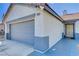 Exterior view showcasing the house number, a two-car garage and a protected front porch entrance at 2345 Steinke Ln, Las Vegas, NV 89108