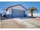 Attractive single-story home featuring a desert landscape, a two car garage, and a concrete driveway at 2345 Steinke Ln, Las Vegas, NV 89108