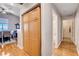 Hallway view showcasing hardwood floors, built in storage cabinet, and access to rooms in the home at 2345 Steinke Ln, Las Vegas, NV 89108