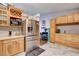 Bright kitchen featuring wood cabinets, stainless steel appliances, and marble flooring at 2345 Steinke Ln, Las Vegas, NV 89108