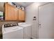 The laundry room offers a washer, dryer, overhead storage, and easy access to hook-ups at 2345 Steinke Ln, Las Vegas, NV 89108