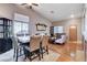 Open-concept living and dining area featuring wood floors, recessed lighting, and comfortable seating at 2345 Steinke Ln, Las Vegas, NV 89108