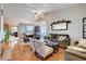 Bright open-concept living room showcasing hardwood floors, a fireplace, and views into the dining area at 2345 Steinke Ln, Las Vegas, NV 89108