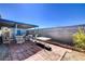 Covered patio with brick pavers, outdoor seating, and view of blue sky above at 2345 Steinke Ln, Las Vegas, NV 89108