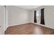 Bedroom featuring hardwood floors, a window, and a neutral color scheme at 2405 Gamma Ray Pl, Henderson, NV 89044