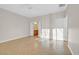 Neutral bedroom with tile flooring, ceiling fan, and access to bathroom at 2405 Gamma Ray Pl, Henderson, NV 89044