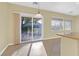 Bright dining area featuring a sliding glass door to the backyard and tile flooring at 2405 Gamma Ray Pl, Henderson, NV 89044