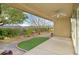 Covered patio with ceiling fan and view of the landscaped backyard at 2405 Gamma Ray Pl, Henderson, NV 89044