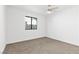 Bedroom features carpet, ceiling fan, and a window at 2415 La Estrella St, Henderson, NV 89014