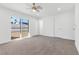 Bright bedroom with large window and ceiling fan providing natural light at 2415 La Estrella St, Henderson, NV 89014