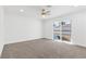 Bright bedroom features a ceiling fan and sliding glass door to the backyard at 2415 La Estrella St, Henderson, NV 89014