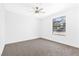 Bright bedroom featuring a large window and ceiling fan at 2415 La Estrella St, Henderson, NV 89014