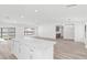 Bright kitchen with marble island and wood-look flooring, showcasing modern design at 2415 La Estrella St, Henderson, NV 89014