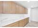 Bright pantry features wooden cabinets and marble countertops providing ample storage space at 2415 La Estrella St, Henderson, NV 89014