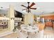 Open-concept dining area next to a fireplace and adjacent to the updated kitchen at 255 El Camino Verde St, Henderson, NV 89074