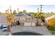 An aerial view showing the front of the house and highlighting the large yard, solar panels and mature landscaping at 255 El Camino Verde St, Henderson, NV 89074