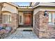 Inviting front entry featuring decorative stonework and a secure gated entrance at 255 El Camino Verde St, Henderson, NV 89074