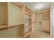 Walk-in closet with custom shelves and clothing rods for ample storage at 255 El Camino Verde St, Henderson, NV 89074