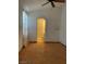 Bedroom featuring parquet wood flooring and an arched doorway at 2694 Hillgrass Rd, Las Vegas, NV 89123