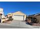 Charming single-story home featuring a two-car garage and desert landscaping at 2694 Hillgrass Rd, Las Vegas, NV 89123