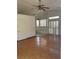 Spacious living room with vaulted ceilings, wood floors, and shuttered windows at 2694 Hillgrass Rd, Las Vegas, NV 89123