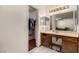 Bathroom featuring a dual sink vanity, a mirror and access to the closet at 2712 Rialto Rd, Las Vegas, NV 89108