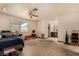 Bedroom featuring a ceiling fan, a window and access to the bathroom at 2712 Rialto Rd, Las Vegas, NV 89108