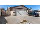 Charming single-story home with a two-car garage and long driveway on a sunny day at 2712 Rialto Rd, Las Vegas, NV 89108