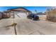 Charming single-story home with a two-car garage and long driveway on a sunny day at 2712 Rialto Rd, Las Vegas, NV 89108