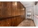 Hallway showcasing wood paneling, decorative lights, and carpeted floors at 2712 Rialto Rd, Las Vegas, NV 89108