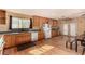 Functional kitchen with wood cabinets, undermount sink, and white appliances at 2712 Rialto Rd, Las Vegas, NV 89108