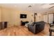 Spacious living room featuring wood floors, a ceiling fan, and modern lighting at 2712 Rialto Rd, Las Vegas, NV 89108