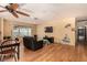 Spacious living room featuring wood floors, a ceiling fan, and modern lighting at 2712 Rialto Rd, Las Vegas, NV 89108