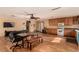 Open-concept living room with wood floors, ceiling fan, and kitchen at 2712 Rialto Rd, Las Vegas, NV 89108