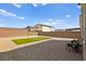 Backyard featuring grass, landscaping, brick pavers and a wall at 2724 High Echelon Rd, North Las Vegas, NV 89086