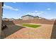 View of backyard featuring grass, landscaping, and brick pavers at 2724 High Echelon Rd, North Las Vegas, NV 89086