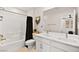 Bathroom featuring double sinks, a shower/bathtub combo with black hardware, and a neutral color palette at 2724 High Echelon Rd, North Las Vegas, NV 89086