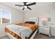 Bedroom with a ceiling fan, a window and a nightstand with drawers at 2724 High Echelon Rd, North Las Vegas, NV 89086