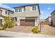 Inviting two-story home featuring a two-car garage and desert landscaping at 2724 High Echelon Rd, North Las Vegas, NV 89086