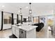 Open concept kitchen featuring a large center island which flows into the living area at 2724 High Echelon Rd, North Las Vegas, NV 89086