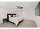 Tranquil main bedroom with tray ceiling, ceiling fan, and plush neutral carpeting at 2724 High Echelon Rd, North Las Vegas, NV 89086