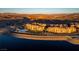 Panoramic aerial view of a lakeside residential area, showcasing architecture and a picturesque waterfront setting at 30 Via Mantova # 202, Henderson, NV 89011