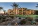 Elegant condominium complex with a manicured putting green and desert surroundings at 30 Via Mantova # 202, Henderson, NV 89011