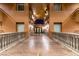 Elegant building hallway with sconce lighting, railings and view of entry doors at 30 Via Mantova # 202, Henderson, NV 89011