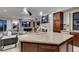 Spacious kitchen with granite island countertop, dark cabinets and stainless steel appliances at 30 Via Mantova # 202, Henderson, NV 89011